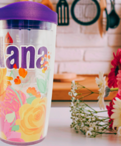 Tervis Nana floral tumbler displayed in kitchen setting with colorful flowers beside insulated tumbler