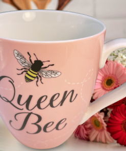 queen bee mug styled in bright kitchen with flowers and soft natural light