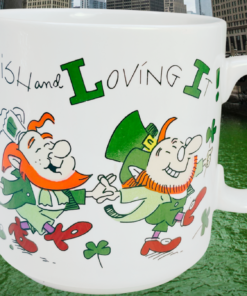 Russ Berrie Irish and Loving It mug with Chicago River dyed green for St Patrick’s Day in background