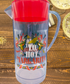 margarita pitcher styled with margaritas and lime garnish