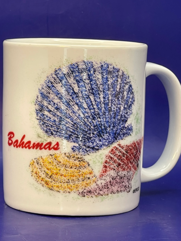 Indulge in the seaside allure of the Bahamas with our Bahamas Shells Souvenir Mug. It’s the perfect #cupofmood and delightful Caribbean charm.