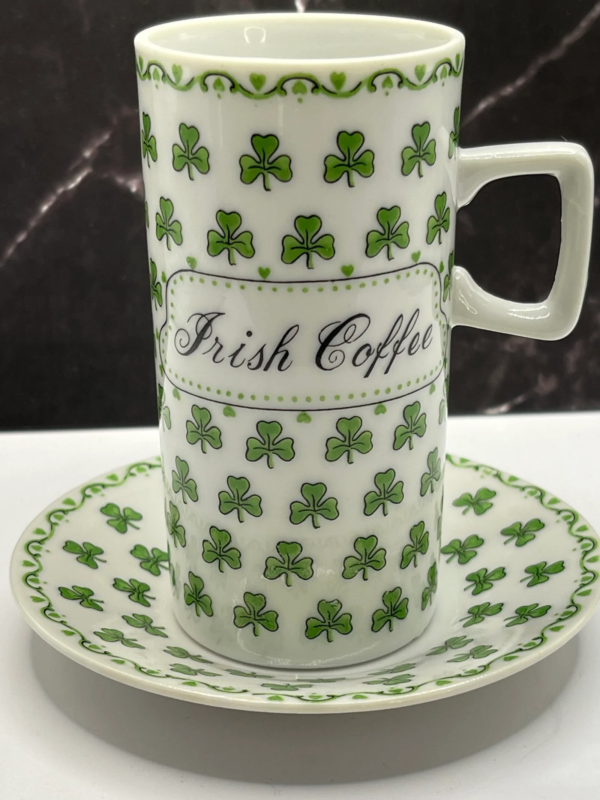 This delightful 4-ounce white ceramic mug and matching saucer are adorned with vibrant green shamrocks. Especially embodying the luck and festive spirit of St. Patrick’s Day.