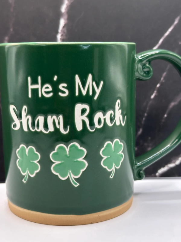The He’s My Sham Rock mug combines Irish charm with romantic wordplay. The green ceramic mug and shamrock design make it a fun gift for couples celebrating St. Patrick’s Day together.