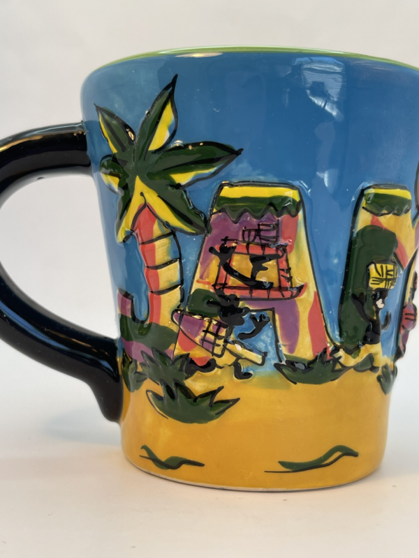 Experience the vibrant spirit of Jamaica with our 3D Jamaica Souvenir Mug. This 14-ounce mug is not just a vessel. It’s also a playful homage to the island’s beauty and culture.