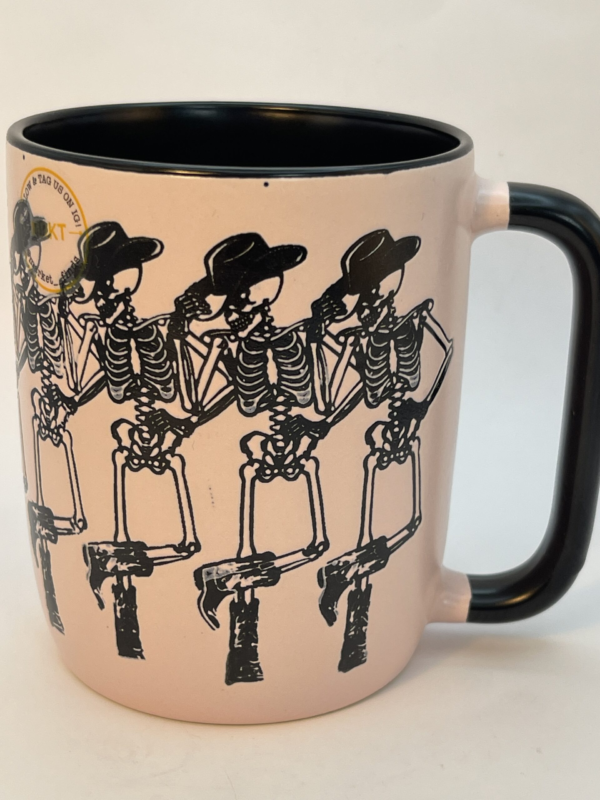 This 20-ounce pink and black ceramic beauty brings the wild west to life with an unexpected twist. Dancing skeletons in full cowgirl gear!