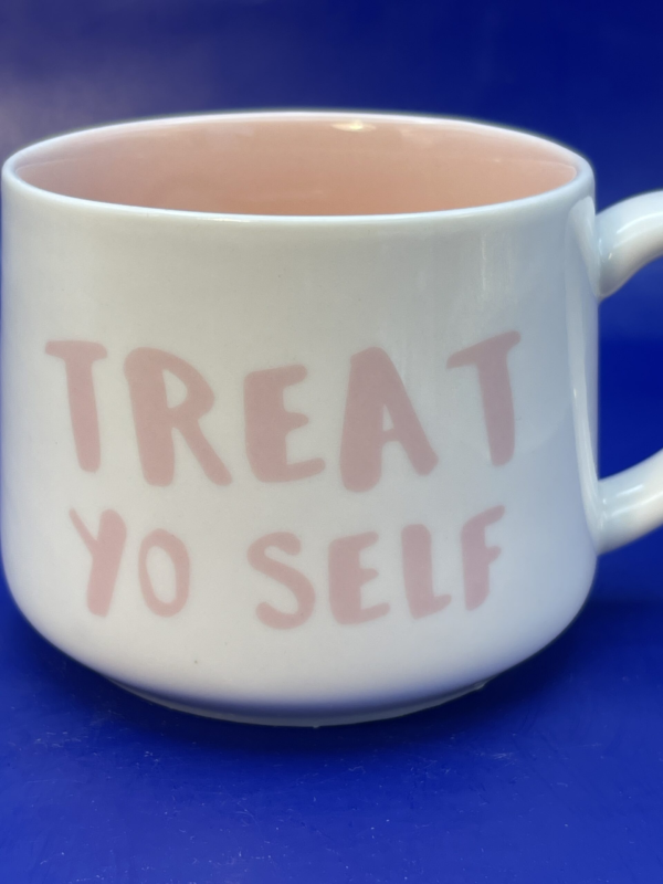 This 12-ounce white ceramic mug is the ultimate way to start your day or unwind after a long one.

In fact, with its bold pink lettering that proudly declares “Treat Yo Self” on both sides. This mug isn’t just a vessel for your favorite beverage. It’s a daily reminder that you deserve a little luxury in your life.