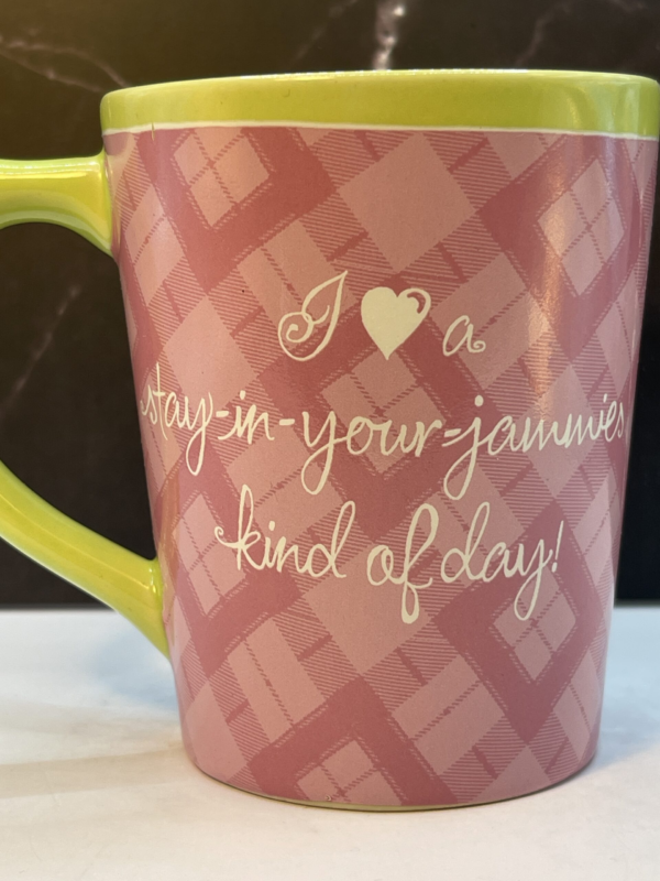  this adorable 12-ounce pink ceramic mug is designed to wrap you in comfort and relaxation.

In fact, with a charming plaid pattern that sets the background for the white script lettering. This mug is all about celebrating the simple pleasures of life.