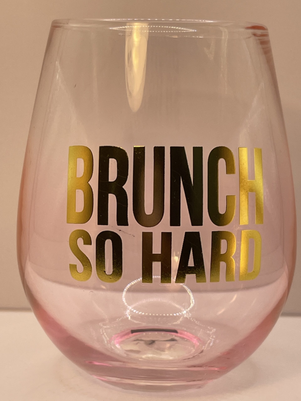 This is a stunning clear 16-ounce stemless wine glass. It’s tinged with a delightful pink hue.

In fact, it features an eye-catching gold lettering that boldly states, “Brunch So Hard.” It’s not just a glass. It’s a celebration of your favorite weekend ritual. Inviting you to sip and savor in style.