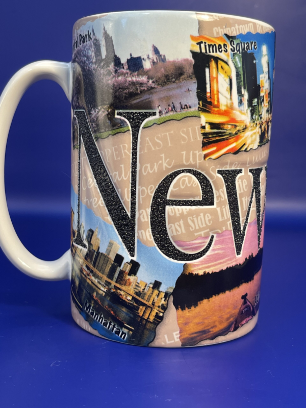 This is a 3D extra large mug. Each of the letters that spell out New York are raised letters. The raised letters go all around the bottom of this Americaware Extra Large New York Coffee Cup. Moreover, the large letters are in written in black with a white outline.