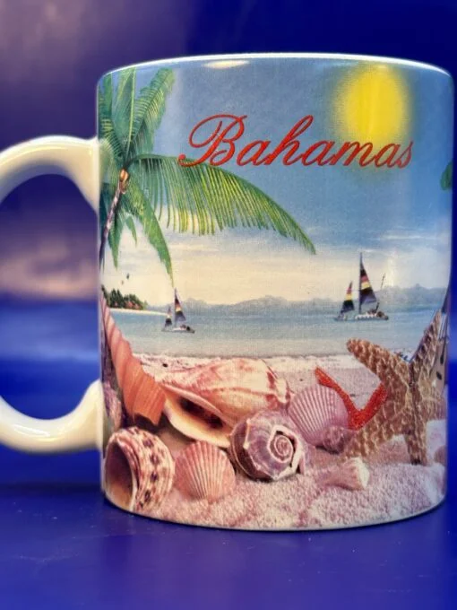 This beautiful 10-ounce white ceramic mug captures the essence of a serene beach scene in the Bahamas.