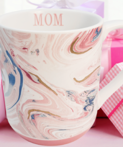 Pink marble mom coffee mug styled with gifts for Mother’s Day celebration