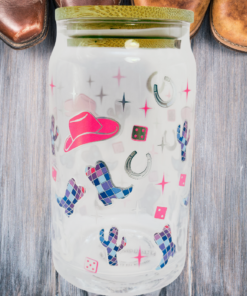 sheffield home cowgirl boots glass tumbler surrounded by cowboy boots western lifestyle scene