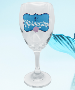 be mermazing mermaid wine glass with large blue mermaid tail beach themed lifestyle scene