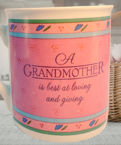 Hallmark grandmother sharing mug styled in cozy kitchen with flowers and basket