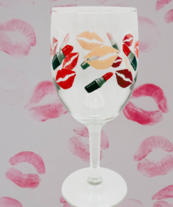 lipstick lips wine glass styled with beauty themed background and pink lips decor