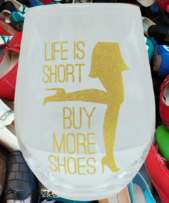 life is short buy more shoes wine glass surrounded by colorful shoes fashion lifestyle scene