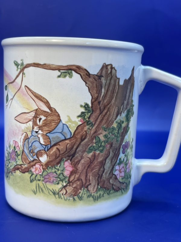 Step into the enchanting world of Beatrix Potter with this delightful Beatrix Potter Squirrel Nutkin Mug.  It’s the perfect #cupofmood and a delightful addition to the Beatrix Potter Collection.

In fact, crafted from fine porcelain, this 6-ounce mug features scenes from the beloved tale of Squirrel Nutkin, bringing to life the whimsy and wonder of Potter’s timeless stories.