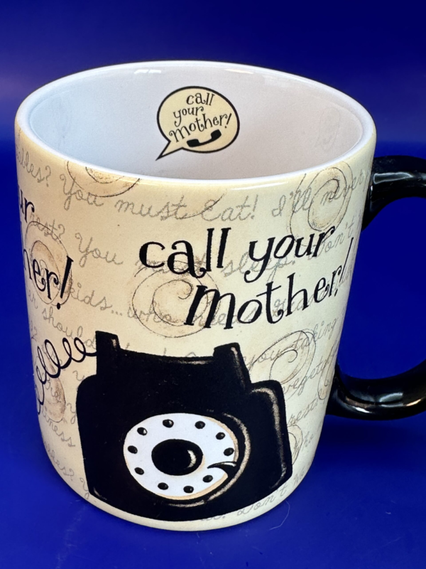 Make every morning a heartfelt reminder to stay connected with our charming Call Your Mother Mug. It’s the perfect #cupofmood and delightful addition to CupofMood Shop’s exclusive Mother’s Day Collection.
In fact, crafted by Lang, this tan 10-ounce Call Your Mother Mug features whimsical artwork by Dan DiPaolo.