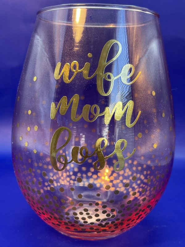 Elevate your sipping experience with our Wife Mom Boss Wine Glass. It’s the perfect #cupofmood because being a multitasking marvel deserves a toast of its own!In fact, this oversized 30-ounce Wife Mom Boss Wine Glass is kissed with a delicate pink hue and adorned with charming gold confetti circles.