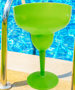 Lime green acrylic margarita glass by poolside setting for outdoor entertaining