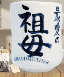 Japanese Calligraphy Grandmother Mug styled in a cozy kitchen scene beside a tea bag for a peaceful tea moment