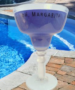 oh margarita blue acrylic margarita glass poolside with water background outdoor setting
