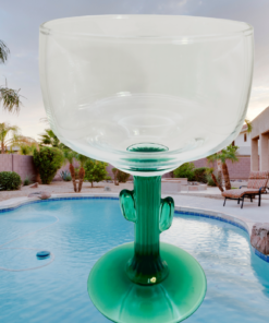 cactus margarita glass by pool creating relaxed summer cocktail vibe