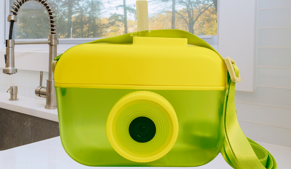 Lime Green Camera Water Bottle With Straw top view showing yellow lid and straw opening