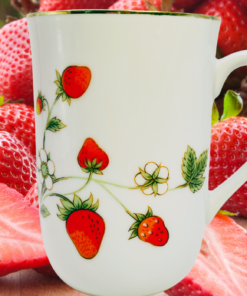 Otagiri Strawberries and Blossoms Mug displayed with fresh strawberries in a garden-inspired setting