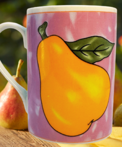 Paul Cardew Pear Mug displayed with fresh pears in a bright kitchen setting