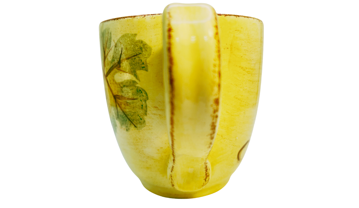 Handle view of Tabletops Unlimited Vino Hand Painted Grape Mug with vineyard artwork