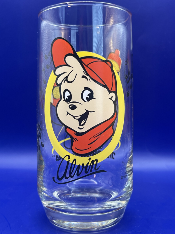 Step back in time and relive the magic of 1985 with our Red Alvin Chipmunks Glass. It’s the perfect #cupofmood and a gem from the Nostalgic Cartoons Collection at Cup Of Mood Shop.In fact, this vintage collectors’ glass is not just a sip of your favorite beverage. It’s a sip of childhood memories and a tangible piece of childhood nostalgia.Indeed Alvin, the mischievous chipmunk, steals the spotlight on the front, decked out in a vibrant red cap and shirt, proudly singing his heart out.Not to mention, the unmistakable charm of yesteryear is encapsulated in every detail, with Alvin’s name elegantly placed beneath him.