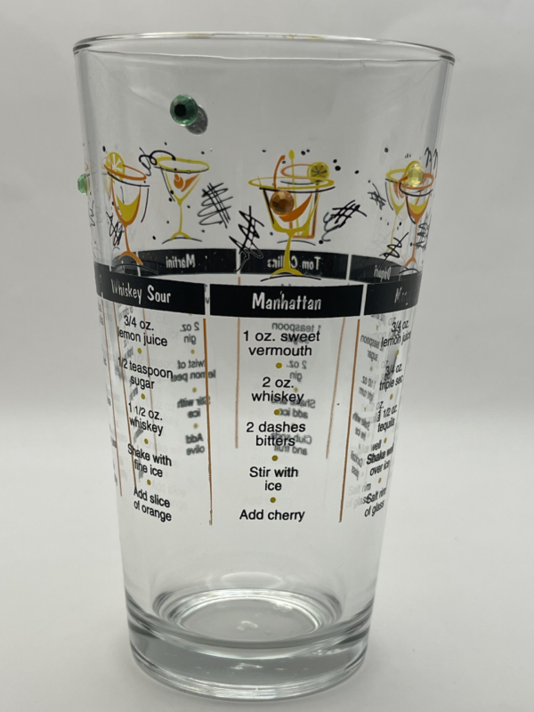 The collectible glass includes printed recipes for a Manhattan along with several additional classic cocktails, creating a fun vintage cocktail lounge feel perfect for entertaining and drink lovers.
