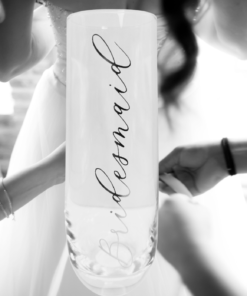 Bridesmaid Champagne Flute displayed with bridal preparation scene in the background