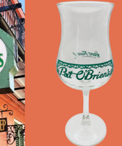 Vintage Pat O’Brien’s New Orleans stemmed cocktail glass styled beside a Pat O’Brien’s sign inspired New Orleans scene