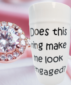 Does This Ring Make Me Look Engaged Latte Mug displayed beside a diamond engagement ring