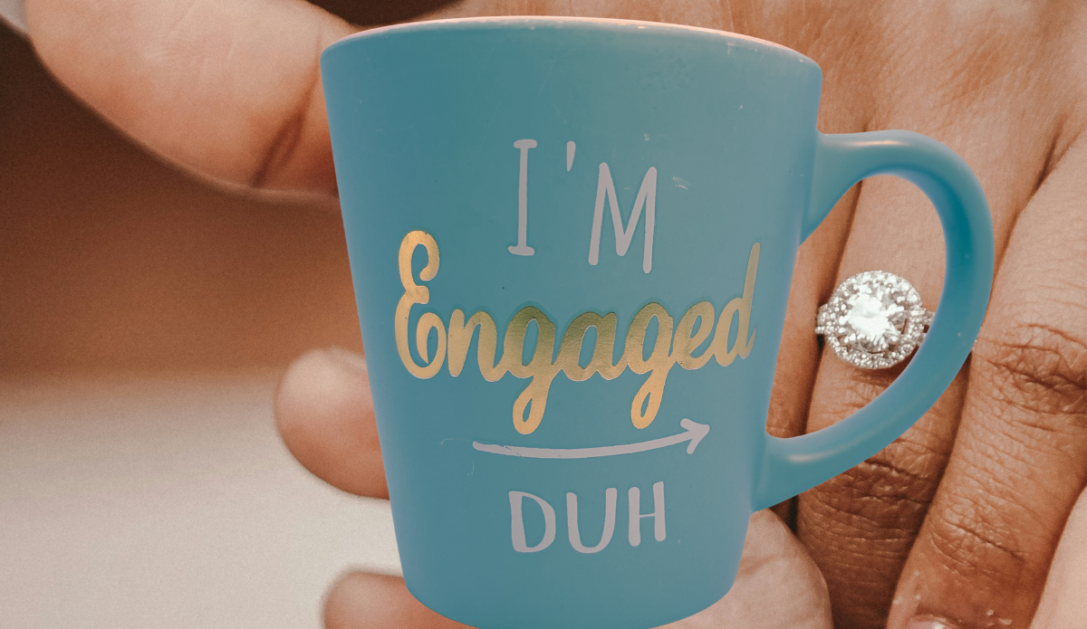 I'm Engaged Duh Mug displayed beside engagement ring lifestyle scene