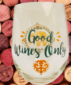 Good Wines Only Elephant Wine Glass styled against a backdrop of wine corks with decorative elephant artwork and playful wine phrase