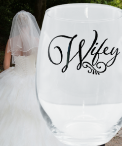 Wifey Stemless Wine Glass displayed with bride in wedding gown lifestyle image