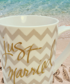 Just Married Chevron Mug displayed on beach scene representing wedding memories and newlywed celebrations