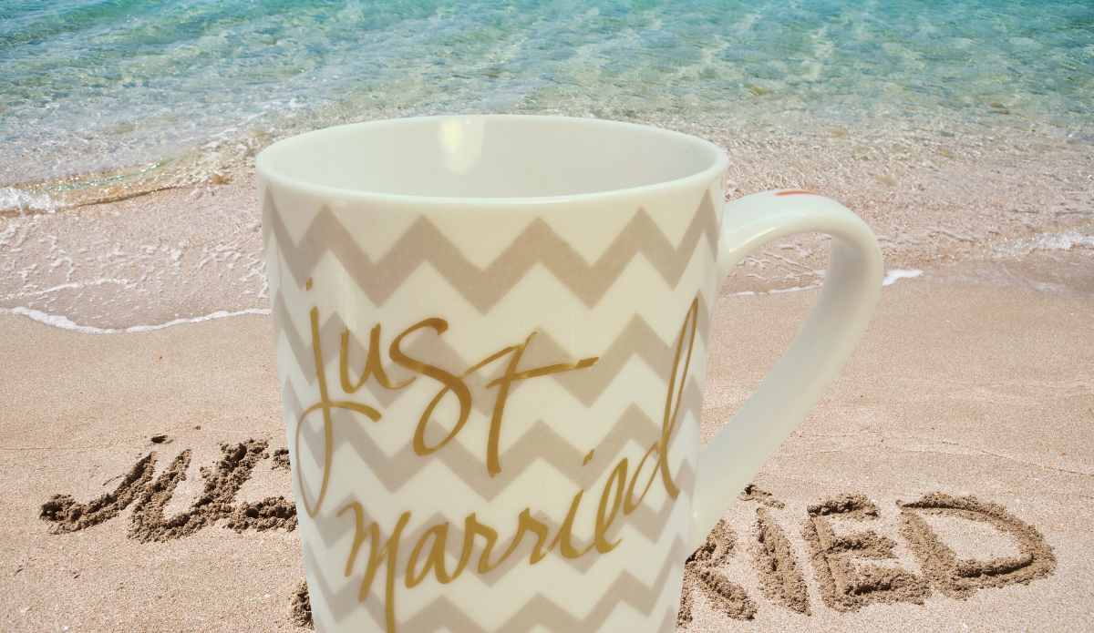 Just Married Chevron Mug displayed on beach scene representing wedding memories and newlywed celebrations
