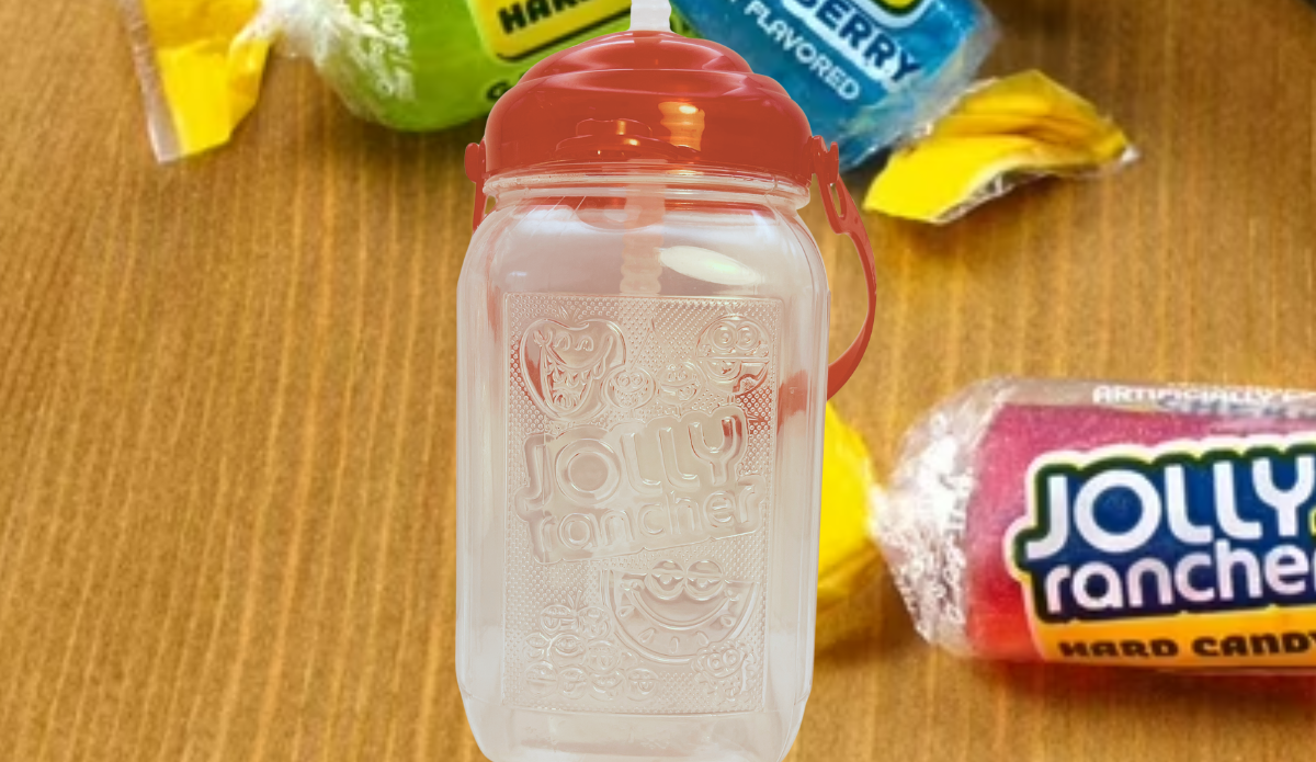 Jolly Rancher Drink Jug With Straw displayed with colorful Jolly Rancher hard candies in the background