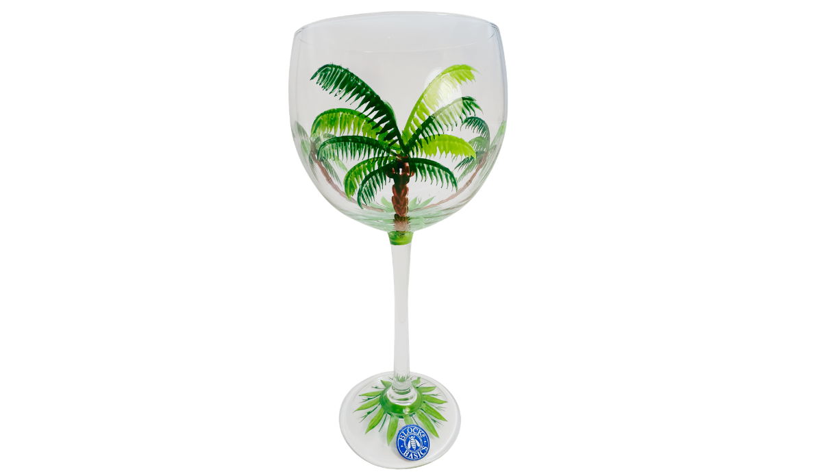 Block Basics Palm Breeze hand painted wine glass front view with large tropical palm tree
