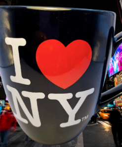 City Merchandise Black I Love NY Bistro Mug displayed in a colorful Times Square New York City scene