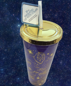 Harry Potter Constellation Cup displayed against a star-filled night sky with gold Hogwarts artwork, lid, straw, and original tag