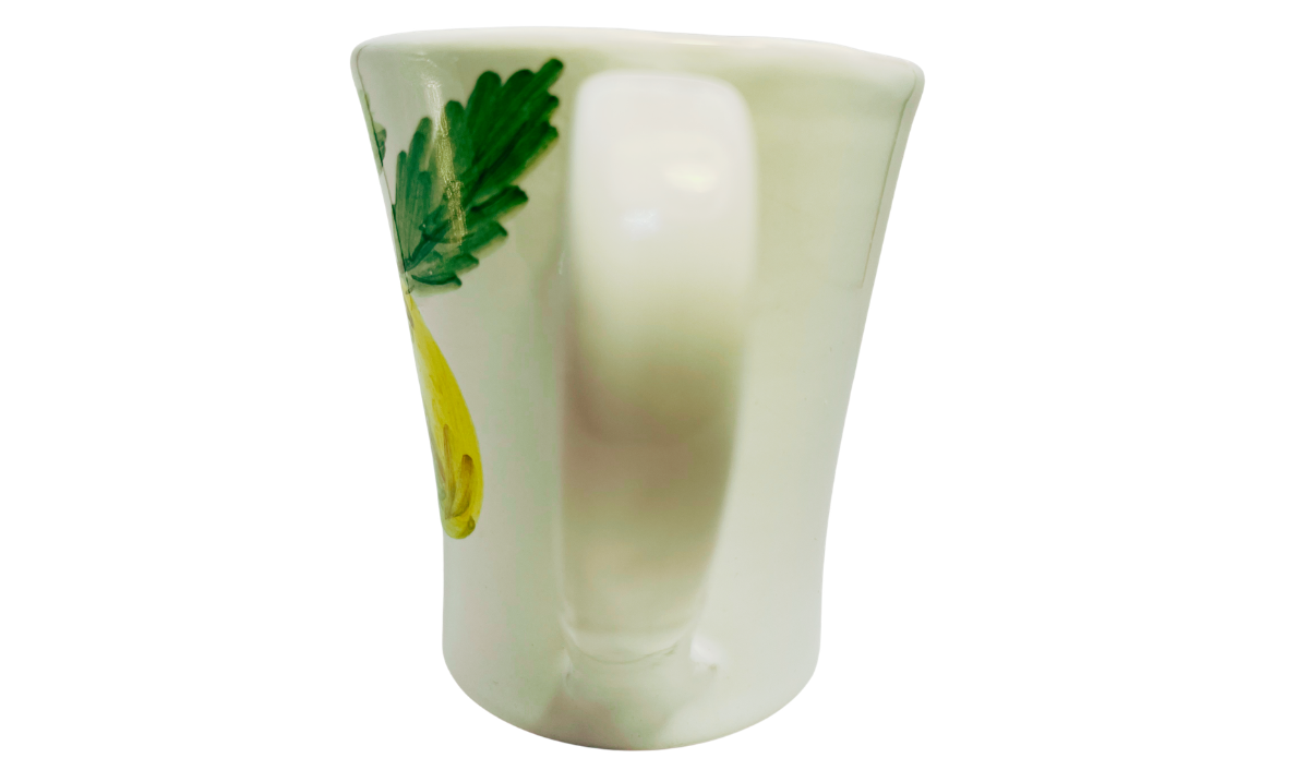 Susan Rubin Golden Apple Mug handle view with centered white loop handle, flared ceramic body, and partial apple and leaf artwork.
