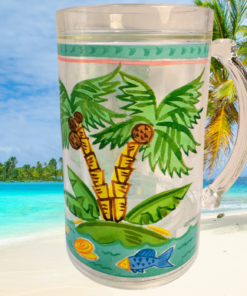 Maret Tropical Palm Tree Freezer Mug displayed on a tropical beach