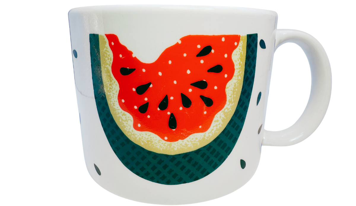 Vintage Tabletops Unlimited Fresh Watermelon Oversized Coffee Mug front view with bitten watermelon artwork, teal rind, black seeds, and white handle.