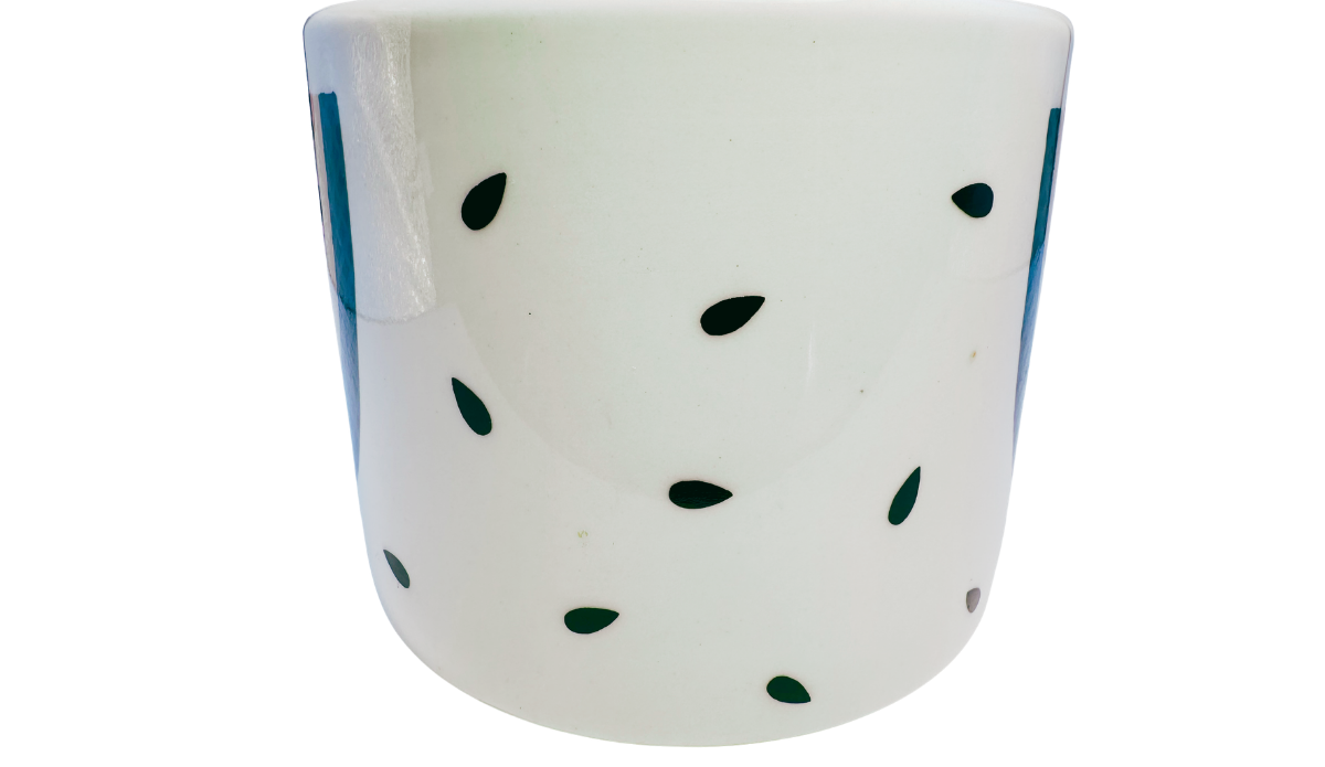 Vintage Tabletops Unlimited Fresh Watermelon Oversized Coffee Mug opposite handle view with scattered dark green seed accents on a glossy white body.