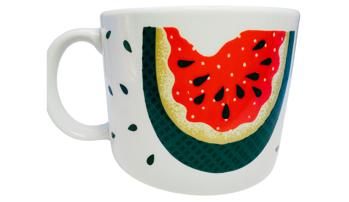 Vintage Tabletops Unlimited Fresh Watermelon Oversized Coffee Mug back view with bitten watermelon artwork, teal rind, dark seeds, and white handle.